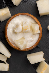 yogurt with melon flavor and ripe and delicious melon close-up