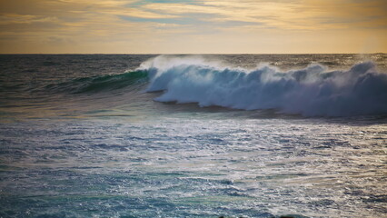 Powerful ocean surf rolling seashore on sunny morning. Slow motion huge waves