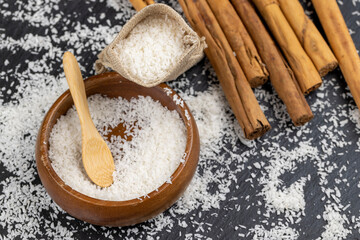 dried coconut shavings on a slate board