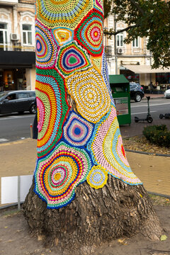 yarnbombing tree with baubles in the winter 