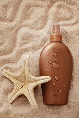 suntan lotion on sand beach background