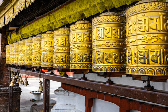 golden buddhist prayer wheels