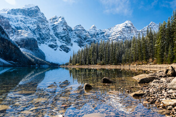 Moraine lake in autumn sunny day morning. Snow-capped Valley of the Ten Peaks reflection on the lake. Banff National Park, Canadian Rockies. Alberta, Canada.