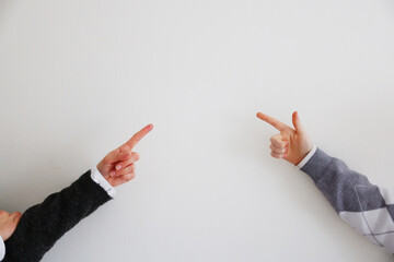 Two Woman's hand are pointing or indicating to copy space area on white background