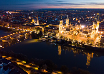 Fototapeta na wymiar Night cityscape of Spanish city Zaragoza (Saragossa) with Cathedral Basilica