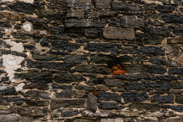 Texture of an ancient stone wall. Stone background.