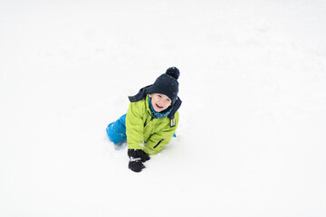 Little Boy Having Fun in the Snow