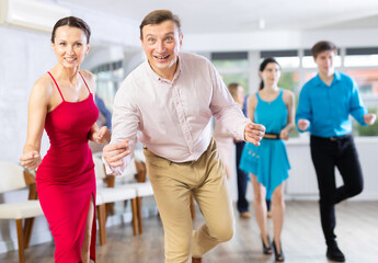 Adult couple dancing and practicing in dance class