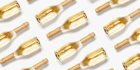Minimal pattern of bottles of white sparkling wine, glass champagne bottles close up, isolated on...