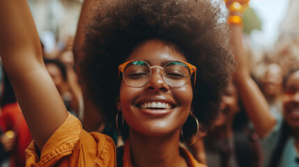 Happy afro woman with hand in the air celebrating black history  - obrazy, fototapety, plakaty