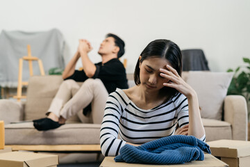 Unhappy young couple, having problems in relationship, thinking of breaking up or divorce, upset.