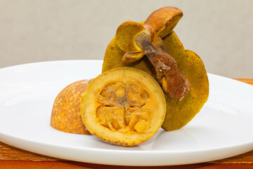 Jenipapo fruit (Genipa americana) in selective focus in details that define the characteristics of the species