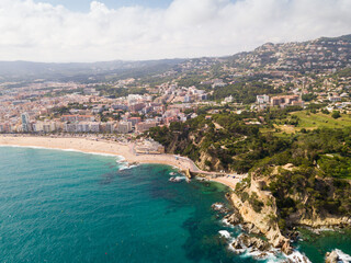 Naklejka premium Picturesque aerial view of Mediterranean coastal town of Lloret de Mar in Catalonia, Spain.