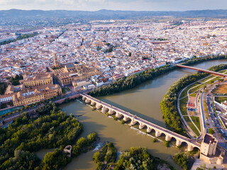 Aerial panoramic view of Mosque-Cathedral of Cordoba and Roman Bridge over the Guadalquivir