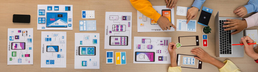 Top view panorama banner of startup company employee planning on user interface prototype for...