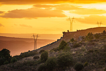 High voltage towers in mountains