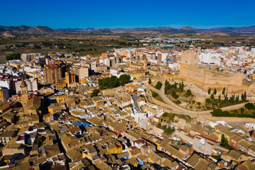 Obraz premium View from drone of cityscape of Villena and medieval moorish Atalaya castle on sunny fall day, Alicante, Spain..
