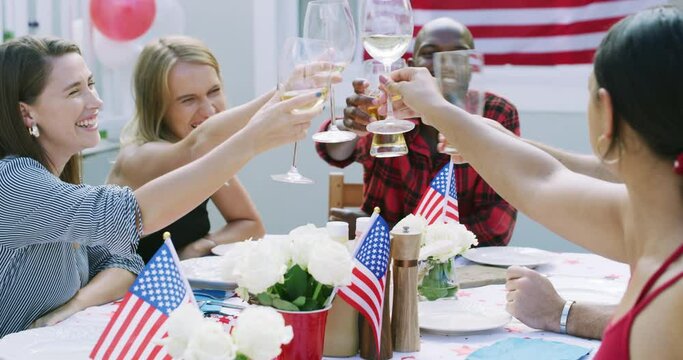 Friends, alcohol and toast, American flag and celebration for Independence Day with drinks and bbq outdoor. Diversity, beer and wine at fourth of July party, holiday and people with cheers in USA