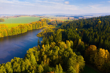 Scenic autumn landscape, aerial view of multi colored trees and lake