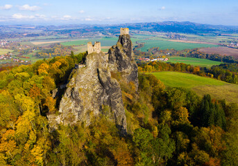 Medieval castle of Trosky on a hill in the forest. Czech Republic