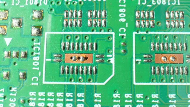A Printed Circuit Board (PCB) is a vital electronic component, serving as a base for electronic connections. It streamlines circuitry, ensuring efficient and compact designs. Macro video.
