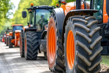 Schilderijen op glas Tractors Line Up in Urban Protest Against Agricultural Tax Increases © JLabrador