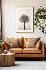 Minimalist living room interior with brown leather sofa and tree artwork