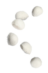Fresh mozzarella balls falling on white background