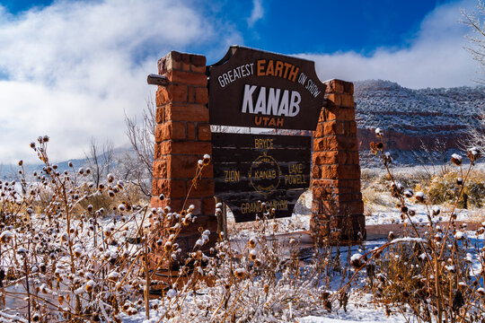 Kanab City Sign with cloud covering the snow mountain.