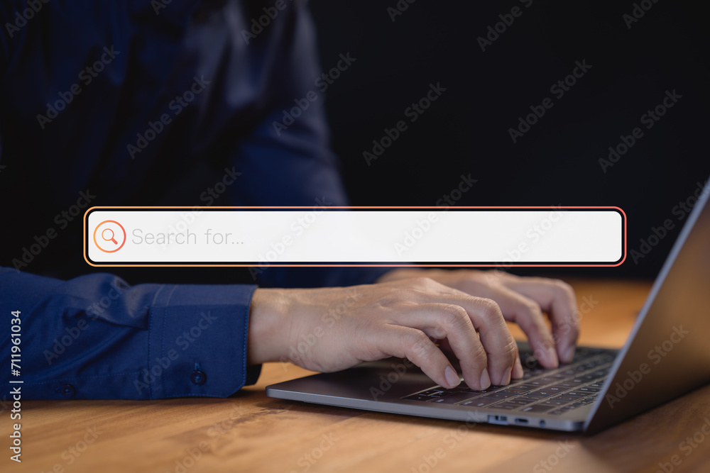Poster Male user using a computer laptop for internet search bar. SEO technology networking engine optimization internet with search bar. Searching browsing internet data information concept.