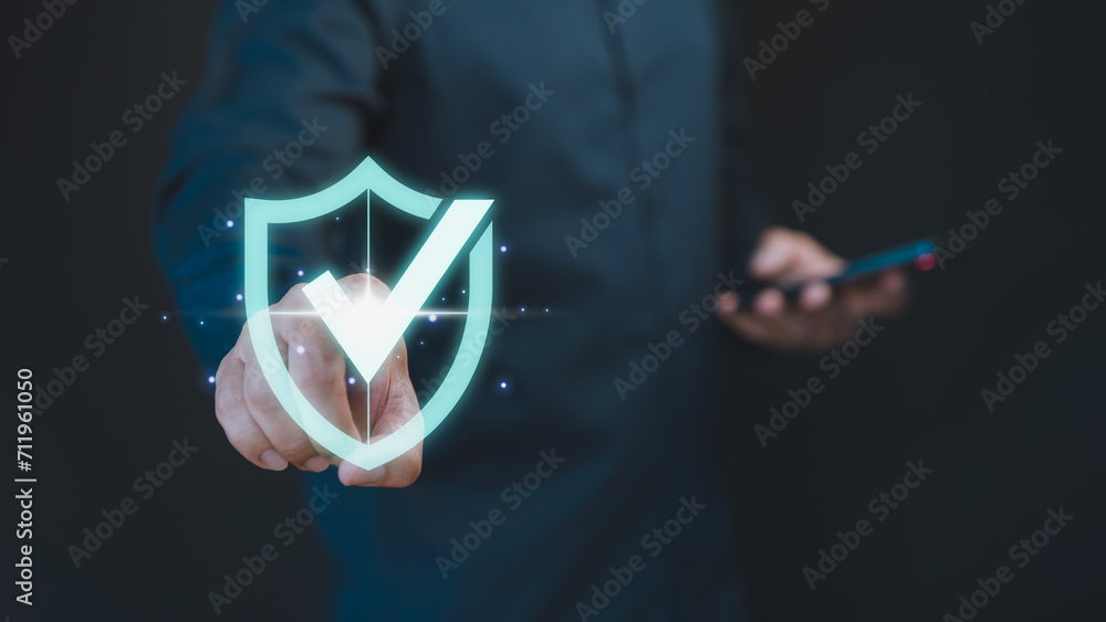 Leinwandbilder Customer hand touch the identity proof icon for security protection system on virtual screen. Quality assurance of business service. Certified guarantee approval or secure access system concept.