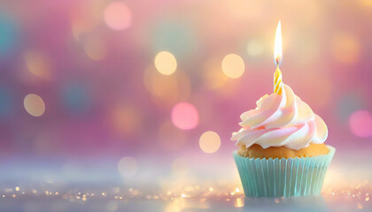 Birthday cupcake with candle on colorful bokeh background.