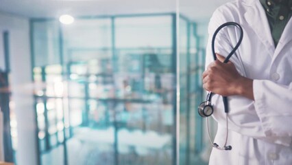 Doctor, arms crossed and stethoscope in hands at hospital for wellness, healthcare and cardiology tools. Person, medic and equipment for listening to heart, lungs or breathing for health in clinic