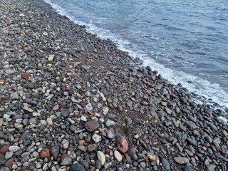 
Jeju Island beach with round basalt rocks.