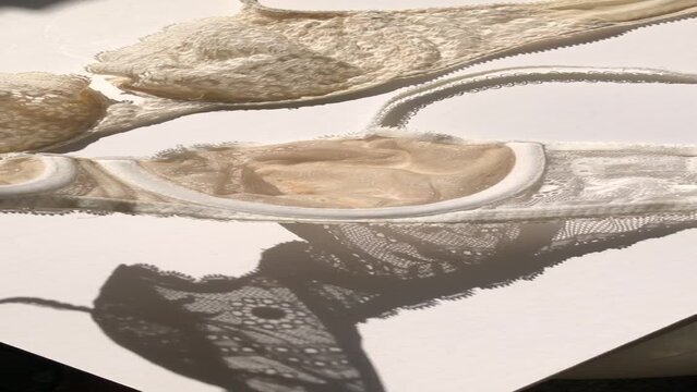 write a long title and list 50 of the best-selling and best-performing tags on adobe stock reel video of a neon magenta-lit contemporary bar where the tables and seats are sitting on a sandbox. Separa