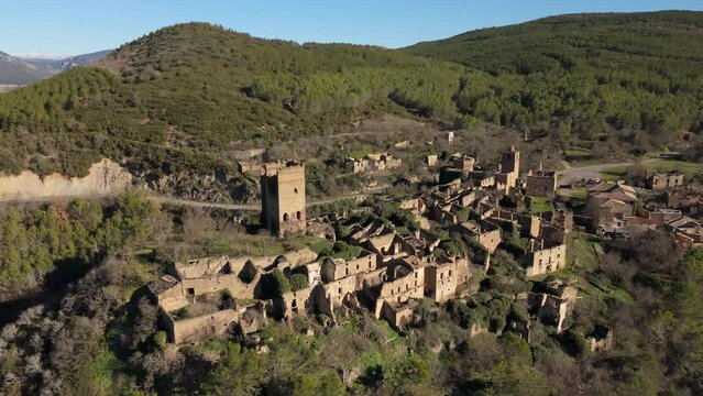 Drone orbiting the medieval castle of the abandoned village of Ruesta, Spain.