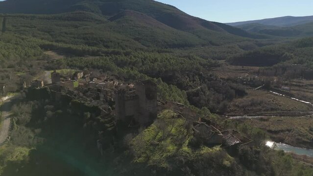 Drone orbiting the medieval castle of the abandoned village of Ruesta, Spain.