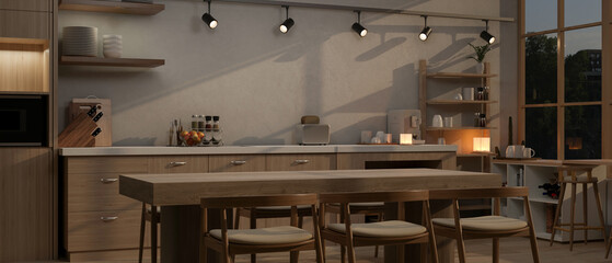 Interior design of a modern, Scandinavian kitchen in the evening with a dining table and decor.