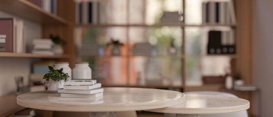 Copy space on a table in a modern, cosy room with bookshelf. reading room, office room, bookstore.