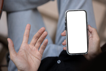 Close-up image of a dissatisfied man using his phone, unhappy with a lack mobile application.