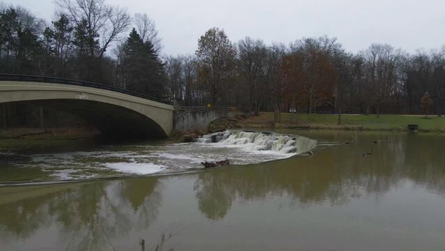 Berea, Ohio Metroparks pan shot of small waterfall and pedestrian bridge.