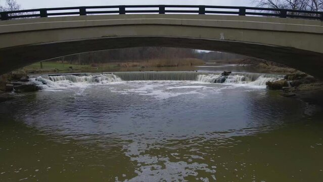 Berea, Ohio Metroparks bridge with small waterfall heading south.
