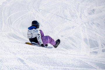 People are having fun in downhill skiing and snowboarding
