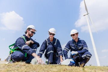 Team engineer wind turbine worker safety uniform survey discuss operational planning windmill field...