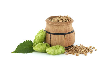Wooden bucket with grains and hops isolated on white