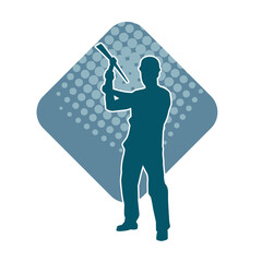 Silhouette of a man in worker costume carrying pick axe tool in action pose. Silhouette of a miner in action pose with pick axe tool.