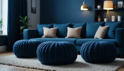Two knitted poufs near dark blue corner sofa  Scandinavian home interior design of modern living room  style