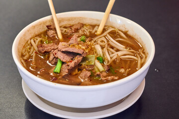 Vietnamese Rice Noodles Soup with Vietnamese Sausage served vegetables and crispy onion - Asian food style