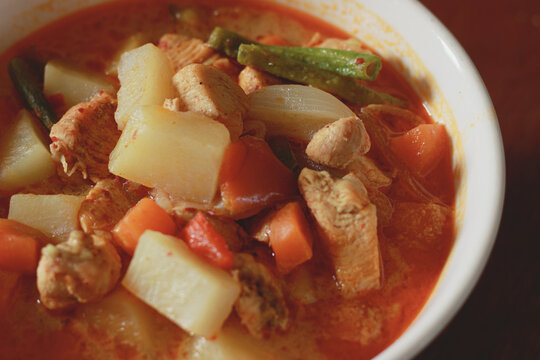 Close up to a bowl of chicken afritada an authentic traditional Filipino dish in the Philippines