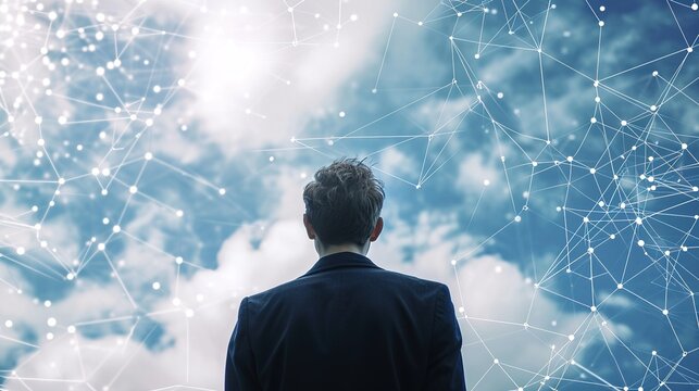 Businessman looking at network in sky